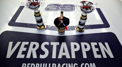 Max Verstappen name with the trophies