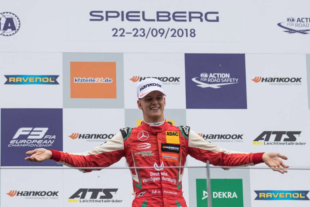 mick schumacher on the top step first race